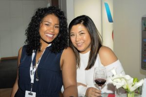 Attendees enjoying happy hour in the American Airlines Passholder Lounge